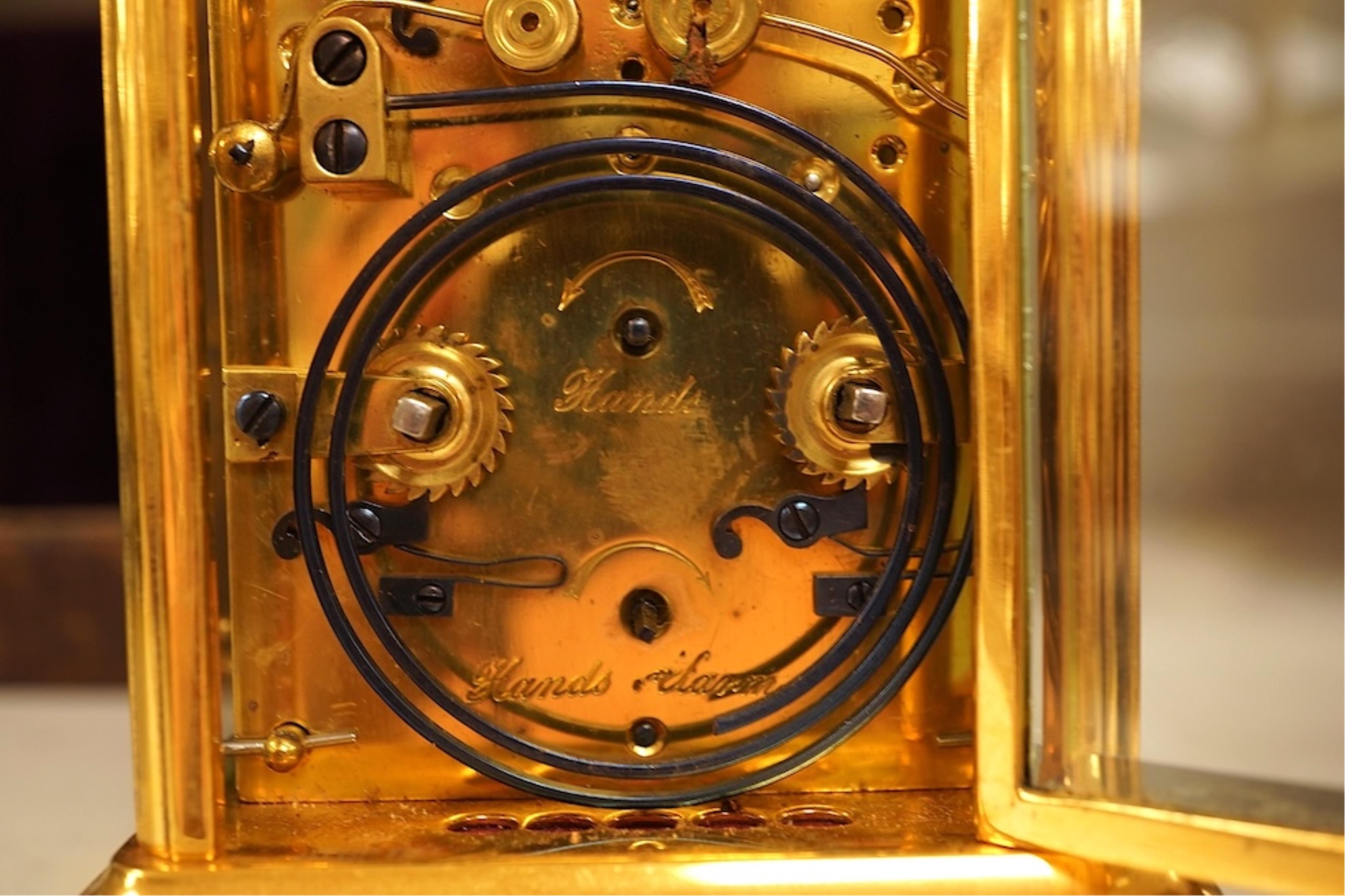 A French carriage clock with alarm, gong-striking movement, in a contemporary leather case, 17cm high